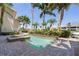 Outdoor community pool nestled among lush landscaping and offers a relaxing waterfront view at 3314 Wood Thrush Dr # 124, Punta Gorda, FL 33950