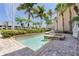 Enjoy this sparkling community pool with lush tropical landscaping and sunny skies at 3314 Wood Thrush Dr # 124, Punta Gorda, FL 33950