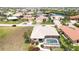 Aerial view showcasing a backyard pool and lanai with a tile roof, nestled in a waterfront community at 3518 Terin Ct, Punta Gorda, FL 33950