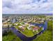An aerial view of a waterfront community with houses surrounded by canals at 3518 Terin Ct, Punta Gorda, FL 33950