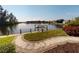 Enjoy waterfront views from this backyard featuring a walkway and boat dock at 3518 Terin Ct, Punta Gorda, FL 33950