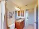 Bathroom features granite countertops, wood cabinetry, and shower-tub combination at 3518 Terin Ct, Punta Gorda, FL 33950