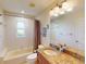 Bathroom with granite countertop, shower, and ample lighting for a functional space at 3518 Terin Ct, Punta Gorda, FL 33950