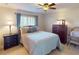Well-lit bedroom with bedside table and a dresser, offering comfortable living space at 3518 Terin Ct, Punta Gorda, FL 33950