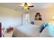 Comfortable bedroom with neutral colors, ceiling fan, and ensuite bathroom access at 3518 Terin Ct, Punta Gorda, FL 33950