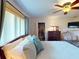 Bedroom features a closet, dresser, TV, and ample natural light for a comfortable space at 3518 Terin Ct, Punta Gorda, FL 33950