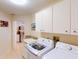 Bright laundry room has granite counters, new appliances, and convenient access to the kitchen at 3518 Terin Ct, Punta Gorda, FL 33950