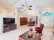 Open-concept living area featuring tile flooring, vaulted ceilings, and a seamless flow to the dining space at 3518 Terin Ct, Punta Gorda, FL 33950