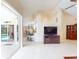 Bright living room with views of the pool area, high ceilings, and tile floors for a clean, modern look at 3518 Terin Ct, Punta Gorda, FL 33950