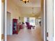 Spacious living area with neutral tile flooring, vaulted ceilings, and a seamless transition to outdoor living at 3518 Terin Ct, Punta Gorda, FL 33950