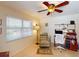 Home office features a built-in desk, shelving, and a comfortable workspace with recliner at 3518 Terin Ct, Punta Gorda, FL 33950