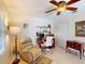 Home office features a built-in desk, shelving, and a comfortable workspace with recliner at 3518 Terin Ct, Punta Gorda, FL 33950