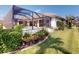 The screened-in lanai features a beautiful pool and spa and lush tropical landscaping at 3518 Terin Ct, Punta Gorda, FL 33950