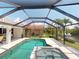 Relax in this pool and spa with a view of the waterfront and tropical landscaping at 3518 Terin Ct, Punta Gorda, FL 33950