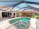 This lovely pool and spa are surrounded by the home and patio with a beautiful tile roof at 3518 Terin Ct, Punta Gorda, FL 33950