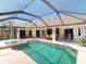 Inviting screened in pool and spa area is perfect for entertaining and outdoor relaxation at 3518 Terin Ct, Punta Gorda, FL 33950