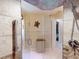 Tiled walk-in shower with glass partition, grab bar, bench, and multiple shower heads at 3518 Terin Ct, Punta Gorda, FL 33950