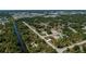 An aerial shot of the property shows its proximity to canals and green spaces in the community at 359 Salisbury St, Port Charlotte, FL 33954