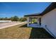 Backyard featuring a covered patio, a well-maintained lawn, and potential for landscaping or outdoor activities at 359 Salisbury St, Port Charlotte, FL 33954