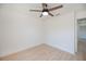 Bright bedroom with a ceiling fan and wood-look flooring throughout at 359 Salisbury St, Port Charlotte, FL 33954