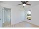 This well lit bedroom has light wood floors and a closet at 359 Salisbury St, Port Charlotte, FL 33954