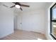 Bedroom featuring a ceiling fan, spacious closet, and lots of natural light at 359 Salisbury St, Port Charlotte, FL 33954