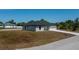 Well-maintained single-Gathering home with a paved driveway and a neatly landscaped yard, offering a welcoming curb appeal at 359 Salisbury St, Port Charlotte, FL 33954