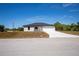 Beautiful one-story home featuring a concrete driveway, two car garage, and dark roof at 359 Salisbury St, Port Charlotte, FL 33954