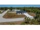 New construction home with a gray roof, light exterior paint, and an attached two car garage at 359 Salisbury St, Port Charlotte, FL 33954