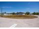 A charming house nestled on a corner lot with a well maintained front yard and paved roads at 359 Salisbury St, Port Charlotte, FL 33954