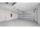 Spacious two-car garage featuring an automatic door opener, electrical panel, and ample room for parking and storage at 359 Salisbury St, Port Charlotte, FL 33954