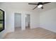 The spacious main bedroom features an ensuite bathroom and a walk-in closet at 359 Salisbury St, Port Charlotte, FL 33954