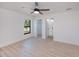 The spacious main bedroom features a ceiling fan and ensuite bathroom with walk-in closet at 359 Salisbury St, Port Charlotte, FL 33954