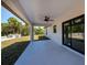 Spacious covered patio with a ceiling fan and an outdoor garden at 359 Salisbury St, Port Charlotte, FL 33954