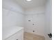 Walk-in closet featuring white walls, a built-in counter, and wire shelving at 359 Salisbury St, Port Charlotte, FL 33954