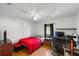 Bedroom with hardwood floors and ceiling fan and a window with curtains for natural light at 3886 Cincinnati St, North Port, FL 34286