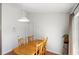 Bright dining room with wood flooring, table with four chairs, and natural light from the window at 3886 Cincinnati St, North Port, FL 34286