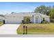 Charming single-story home with well-maintained landscaping, a two-car garage, and a inviting front entrance at 3886 Cincinnati St, North Port, FL 34286