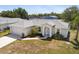 Charming single-story home with a well-manicured lawn and attached two-car garage at 3886 Cincinnati St, North Port, FL 34286