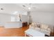 The living room features an open layout with hardwood floors, seamlessly connecting to the kitchen and dining areas at 3886 Cincinnati St, North Port, FL 34286