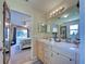 Bright bathroom with double sinks and views of the main bedroom at 4092 Troost St, North Port, FL 34288