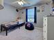 This room with fan features themed decor, window, and a comfy beanbag seating area at 4092 Troost St, North Port, FL 34288