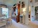 Dining area featuring a wooden hutch, elegant furnishings, and a view of the laundry room at 4092 Troost St, North Port, FL 34288