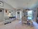 Cozy dining area featuring a farmhouse-style table and plenty of natural light at 4092 Troost St, North Port, FL 34288