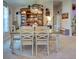 Open dining room showcasing a wooden table, comfortable seating, and stylish decor at 4092 Troost St, North Port, FL 34288