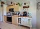 Well-organized kitchen with modern appliances, wooden cabinets, and ample counter space at 4092 Troost St, North Port, FL 34288