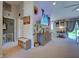 Bright living room featuring a large TV, comfortable seating, and stylish decor at 4092 Troost St, North Port, FL 34288