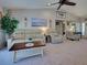 Spacious living room with a comfortable seating arrangement and lots of natural light at 4092 Troost St, North Port, FL 34288
