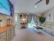 Open living room with a sliding glass door to the backyard and neutral color palette at 4092 Troost St, North Port, FL 34288