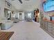 Open-concept living and dining area, with an elegant hutch and large flatscreen TV at 4092 Troost St, North Port, FL 34288